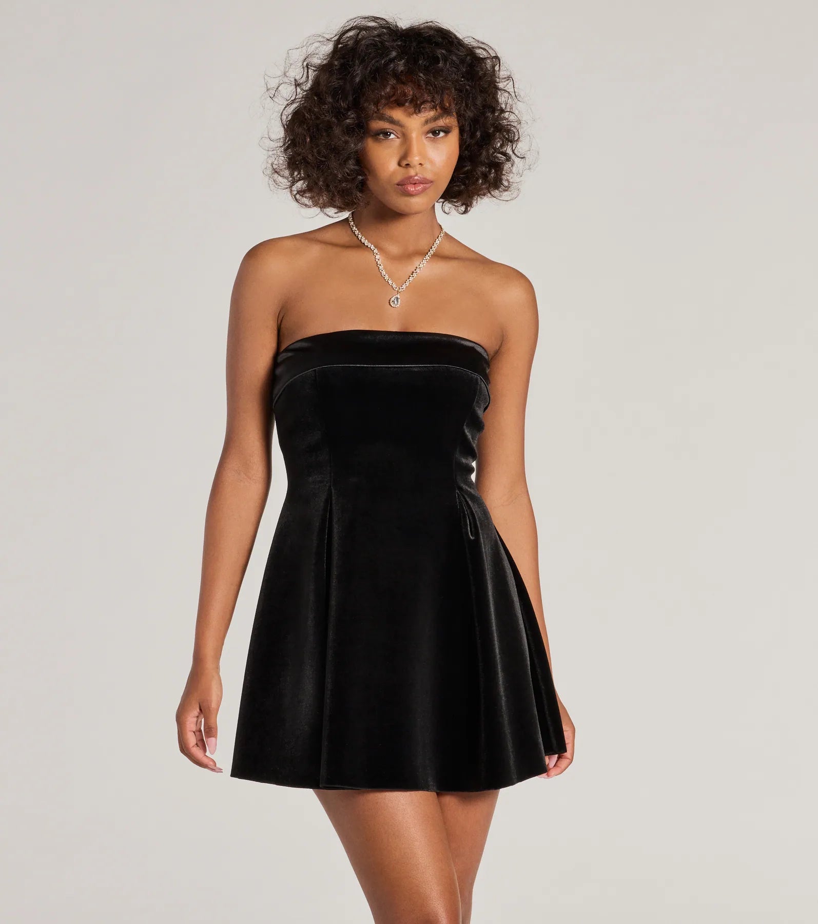 Mini dresses with asymmetric hems for a fashion - forward look Ella Strapless Pleated Velvet Skater Dress Mini dresses with asymmetric hems for a fashion - forward look Ella Strapless Pleated Velvet Skater Dress