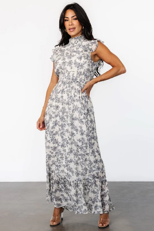 Maxi dresses with a keyhole back for a sexy detailKearny Ruffle Maxi Dress | Cream + Navy Floral Maxi dresses with a keyhole back for a sexy detailKearny Ruffle Maxi Dress | Cream + Navy Floral