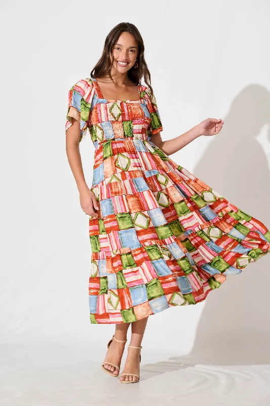 Midi dresses with ruffled bodices for a more pronounced feminine lookJessica Midi Dress in Rust Multi Squares Print Midi dresses with ruffled bodices for a more pronounced feminine lookJessica Midi Dress in Rust Multi Squares Print
