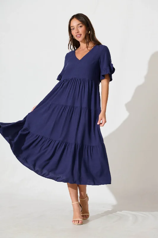 Midi dresses with mesh inserts for a trendy and breathable optionKristen Midi Smock Dress In Navy Linen Blend Midi dresses with mesh inserts for a trendy and breathable optionKristen Midi Smock Dress In Navy Linen Blend