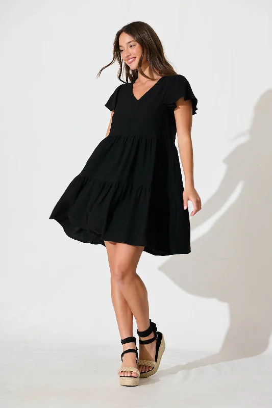 Midi dresses with ruffled sleeves for a more feminine and voluminous lookTahiti Smock Dress In Black Linen Blend Midi dresses with ruffled sleeves for a more feminine and voluminous lookTahiti Smock Dress In Black Linen Blend